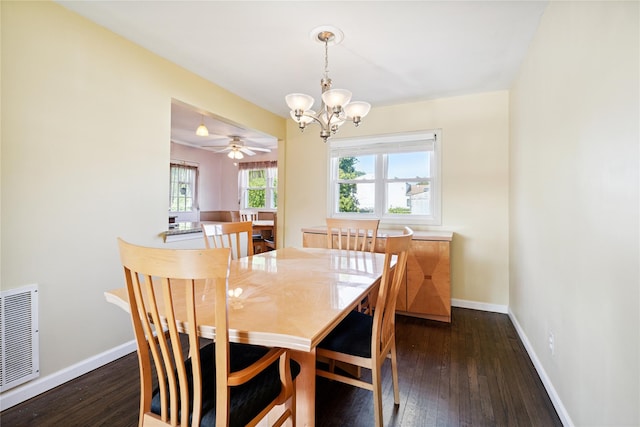 343 W 16th St, Deer Park, NY 11729 - dining room featuring a chandelier and dark wood-style flooring