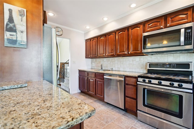 343 W 16th St, Deer Park, NY 11729 - kitchen with appliances with stainless steel finishes, crown molding, light stone counters, backsplash, and recessed lighting