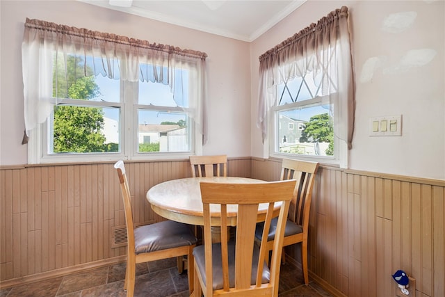 343 W 16th St, Deer Park, NY 11729 - dining room featuring wainscoting, wooden walls, crown molding, and stone finish floors