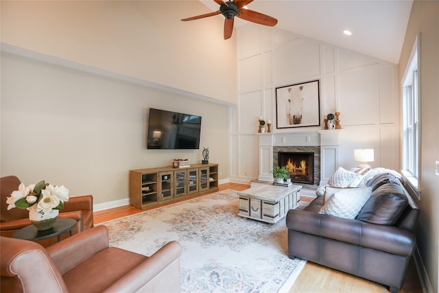 212 Weber Hill Rd, Carmel, NY 10512 - living area featuring a ceiling fan, wood finished floors, a lit fireplace, recessed lighting, and high vaulted ceiling