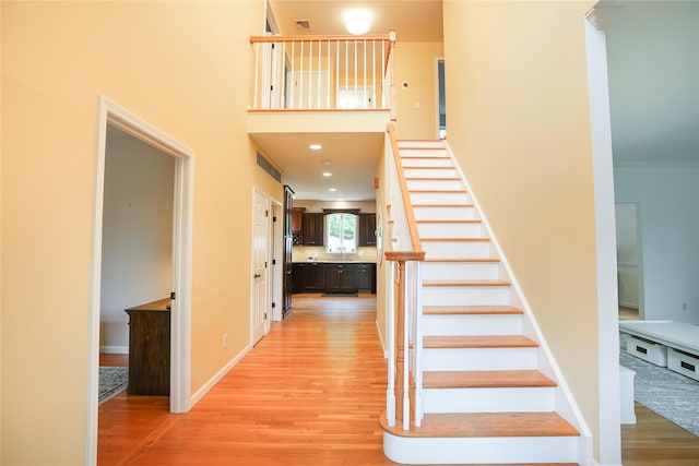 212 Weber Hill Rd, Carmel, NY 10512 - staircase featuring wood finished floors and a high ceiling