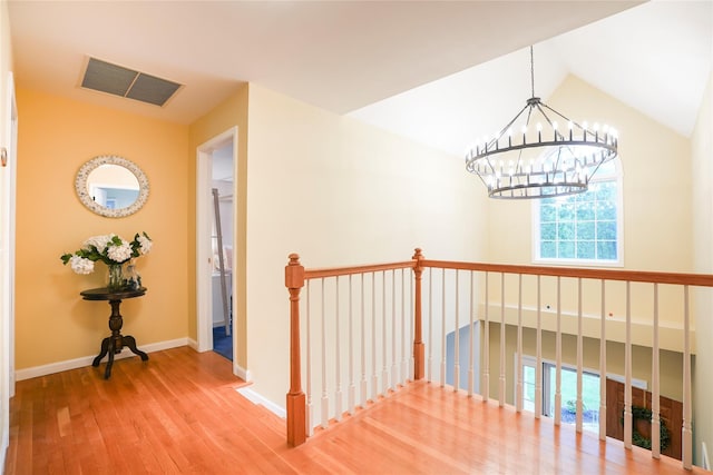 212 Weber Hill Rd, Carmel, NY 10512 - corridor with wood finished floors, a chandelier, an upstairs landing, and vaulted ceiling