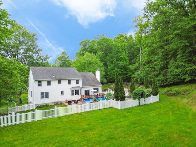 212 Weber Hill Rd, Carmel, NY 10512 - back of house featuring a chimney, a fenced backyard, a shingled roof, and a wooden deck