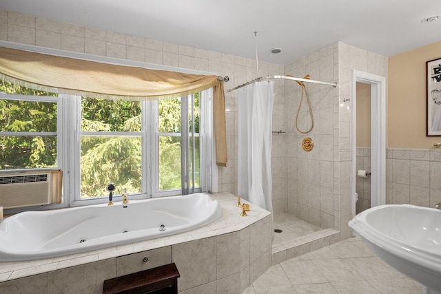 63 Bonnie Meadow Rd, Scarsdale, NY 10583 - bathroom featuring healthy amount of natural light, a whirlpool tub, tiled shower, and tile walls