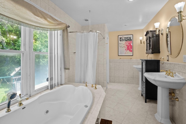 63 Bonnie Meadow Rd, Scarsdale, NY 10583 - bathroom featuring a tub with jets, a stall shower, tile walls, wainscoting, and tile patterned floors