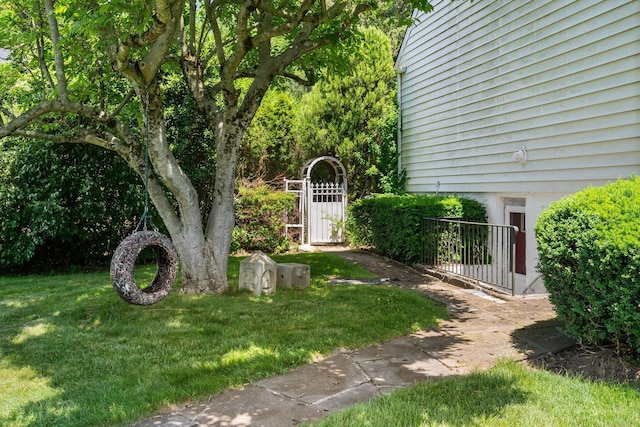 63 Bonnie Meadow Rd, Scarsdale, NY 10583 - view of green lawn with a gate