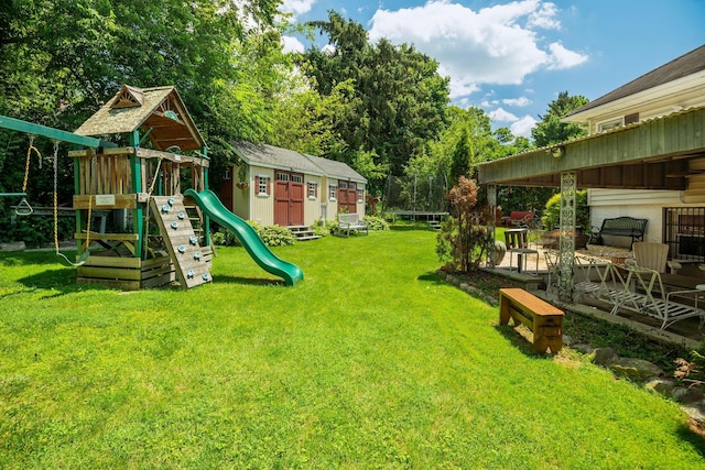 63 Bonnie Meadow Rd, Scarsdale, NY 10583 - view of green lawn with a playground and an outdoor structure