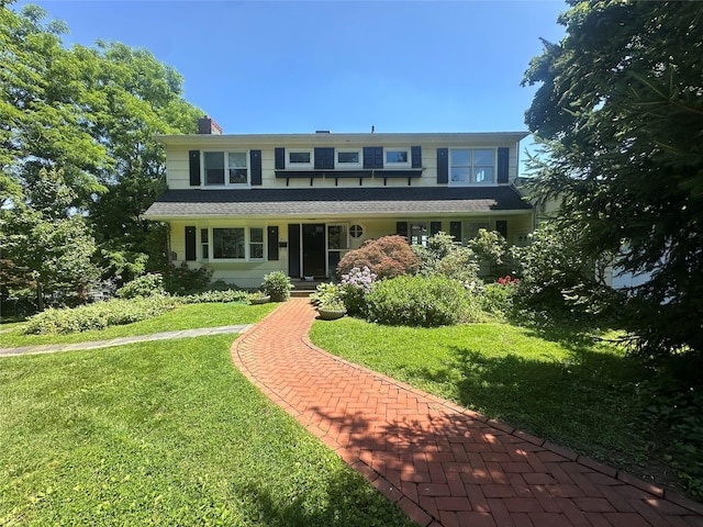 81 Seaview Ave, New Rochelle, NY 10801 - view of front of property featuring a front yard and a chimney