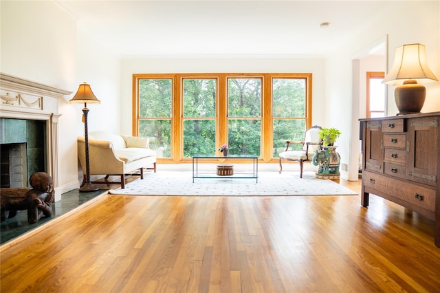 81 Seaview Ave, New Rochelle, NY 10801 - living area with ornamental molding, wood finished floors, healthy amount of natural light, and a tile fireplace