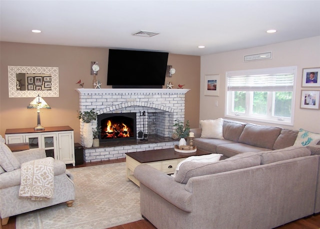 68 Palmer Dr, Sayville, NY 11782 - living area with a brick fireplace, light wood-style floors, and recessed lighting