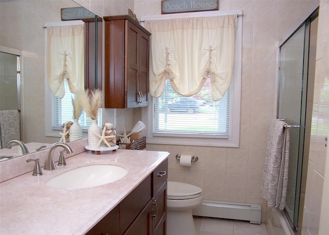 68 Palmer Dr, Sayville, NY 11782 - full bathroom featuring a baseboard radiator, vanity, a shower stall, tile patterned flooring, and tile walls
