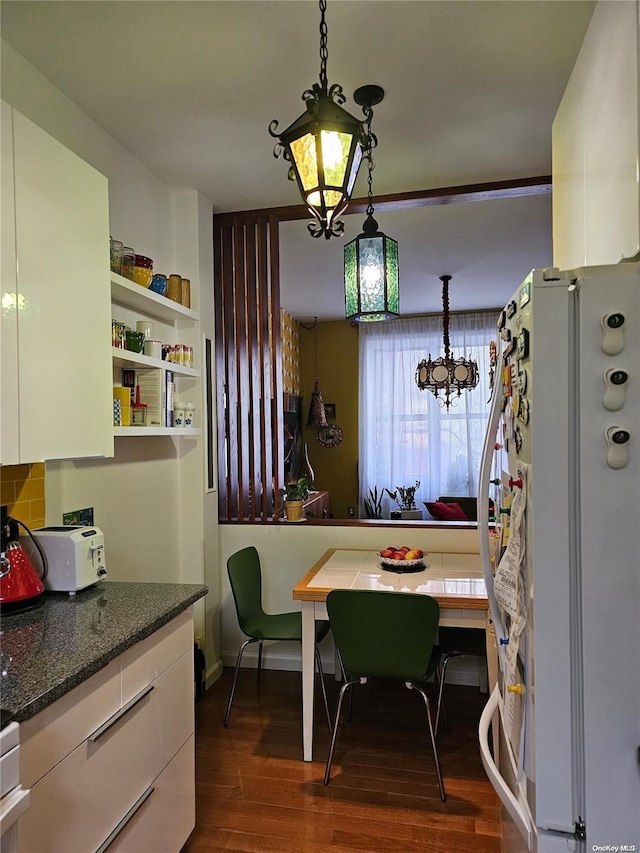 616 W 137th St Unit 1D, New York Manhattan, NY 10031 - dining area featuring dark wood-style floors and a chandelier
