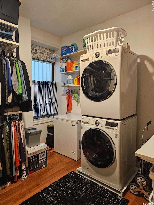 616 W 137th St Unit 1D, New York Manhattan, NY 10031 - laundry area featuring stacked washer and clothes dryer and wood finished floors