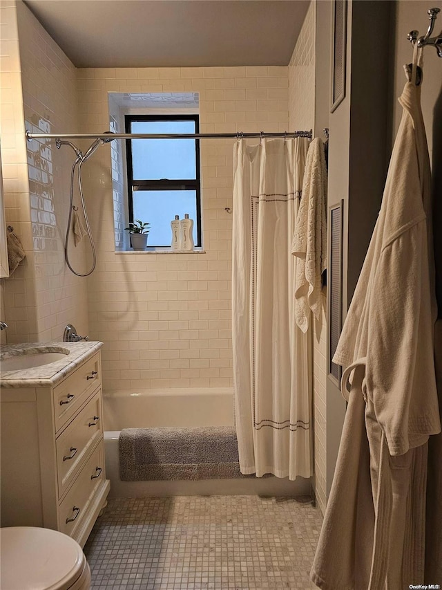 616 W 137th St Unit 1D, New York Manhattan, NY 10031 - full bath featuring vanity, shower / bath combo with shower curtain, and tile patterned floors