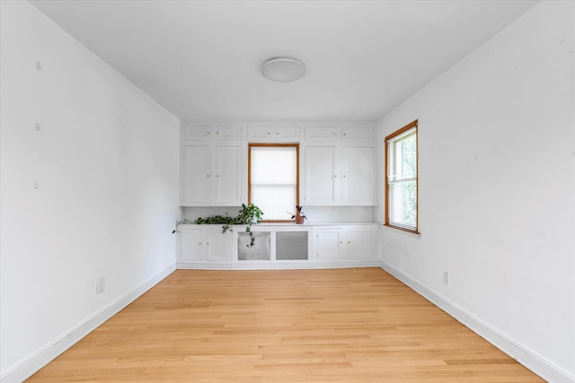 18 Hathaway Dr, Garden City, NY 11530 - empty room with light wood-style floors and baseboards