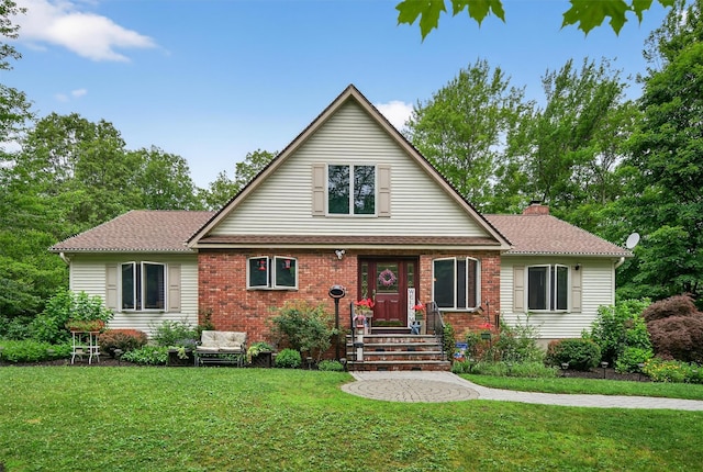 189 School House Rd, Middletown, NY 10940 - view of front of house with a front lawn, a chimney, and brick siding
