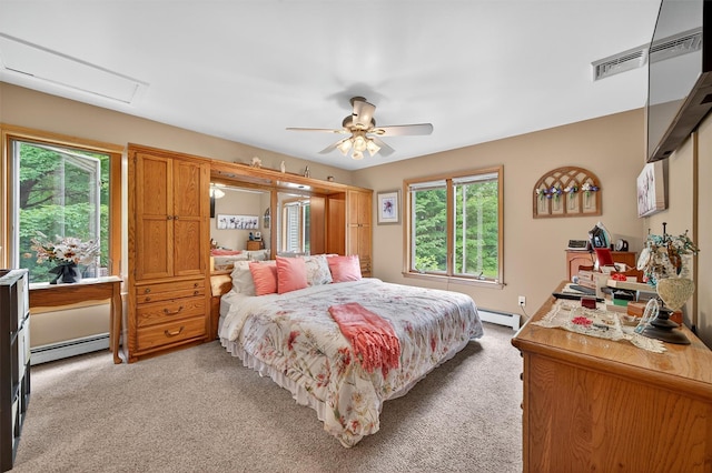 189 School House Rd, Middletown, NY 10940 - bedroom with a baseboard heating unit, light colored carpet, and multiple windows