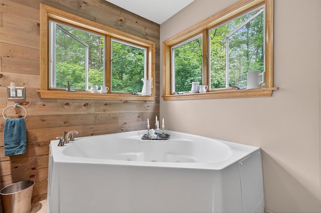189 School House Rd, Middletown, NY 10940 - bathroom featuring wood walls, plenty of natural light, and a jetted tub