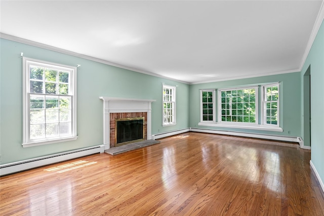 6 Beardsley Ln, Lloyd Harbor, NY 11743 - unfurnished living room featuring a baseboard heating unit, ornamental molding, healthy amount of natural light, and wood finished floors