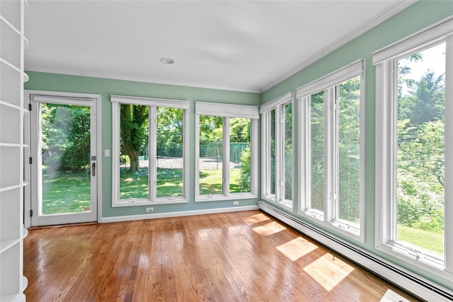 6 Beardsley Ln, Lloyd Harbor, NY 11743 - unfurnished sunroom with a baseboard radiator, plenty of natural light, crown molding, and wood finished floors