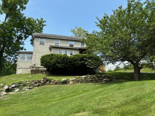 11 Seaman Rd, Stormville, NY 12582 - back of house with a yard