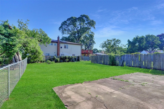 9 Rhodes Ln, West Hempstead, NY 11552 - fenced backyard featuring a patio