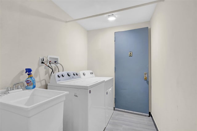 9 Rhodes Ln, West Hempstead, NY 11552 - laundry room with separate washer and dryer and light wood-style floors
