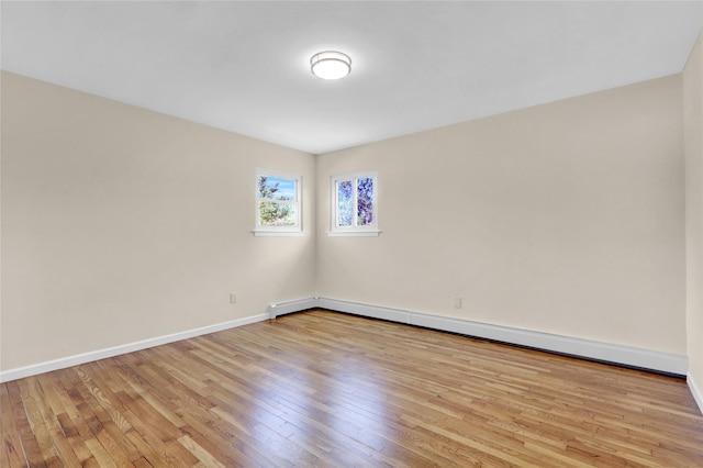9 Rhodes Ln, West Hempstead, NY 11552 - unfurnished room with a baseboard radiator and light wood-style floors