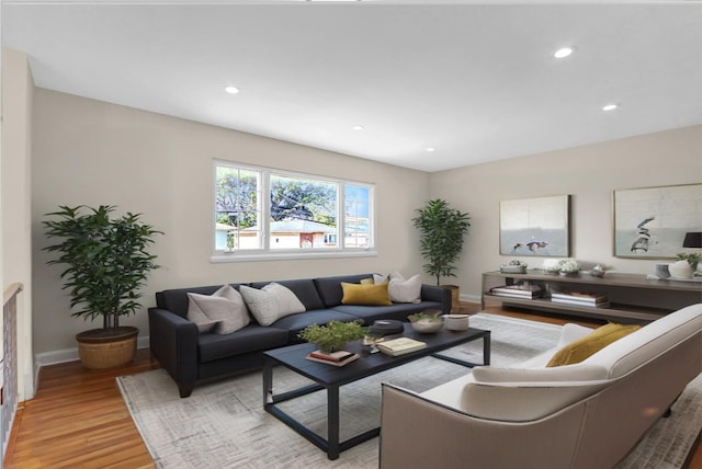 9 Rhodes Ln, West Hempstead, NY 11552 - living room with light wood-type flooring and recessed lighting