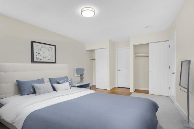 9 Rhodes Ln, West Hempstead, NY 11552 - bedroom with multiple closets and baseboards