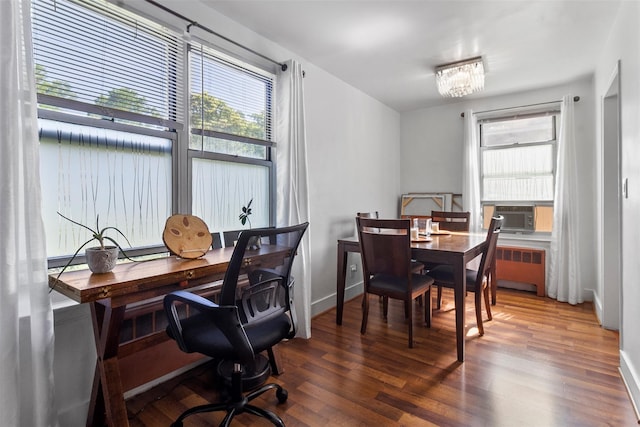 84 Spruce St Unit 1A, Yonkers, NY 10701 - dining room with cooling unit, healthy amount of natural light, radiator heating unit, and wood finished floors