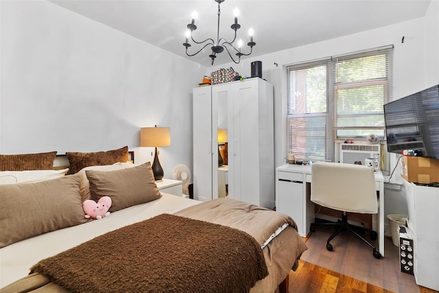 84 Spruce St Unit 1A, Yonkers, NY 10701 - bedroom featuring a chandelier, wood finished floors, a desk, and cooling unit