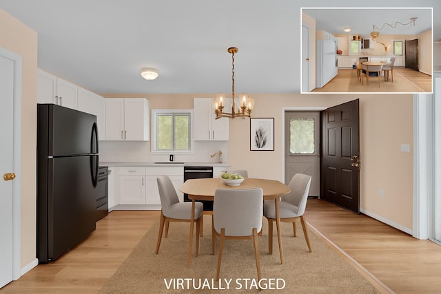 156 Creamery Rd Unit Tr20, Swan Lake, NY 12783 - dining space with light wood-style floors and a chandelier