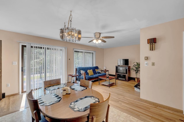 156 Creamery Rd Unit Tr20, Swan Lake, NY 12783 - dining room featuring ceiling fan, light wood-style flooring, and a chandelier