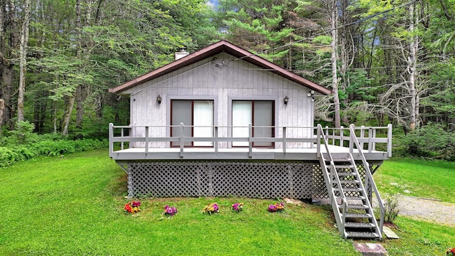 156 Creamery Rd Unit Tr20, Swan Lake, NY 12783 - view of front of property with a front lawn, stairs, a wooden deck, and a chimney