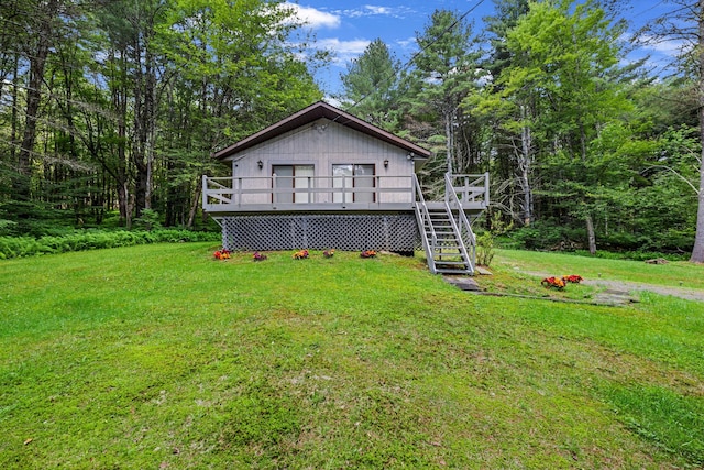 156 Creamery Rd Unit Tr20, Swan Lake, NY 12783 - rear view of house with a lawn, a wooden deck, and stairway
