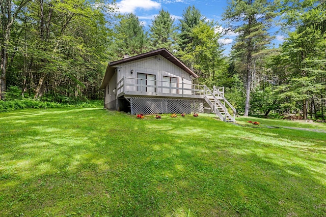 156 Creamery Rd Unit Tr20, Swan Lake, NY 12783 - rear view of house with a deck, a lawn, and stairs