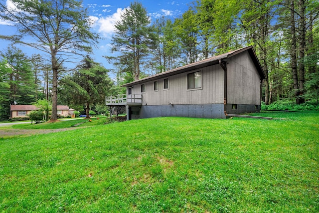 156 Creamery Rd Unit Tr20, Swan Lake, NY 12783 - view of side of home featuring a yard and a wooden deck
