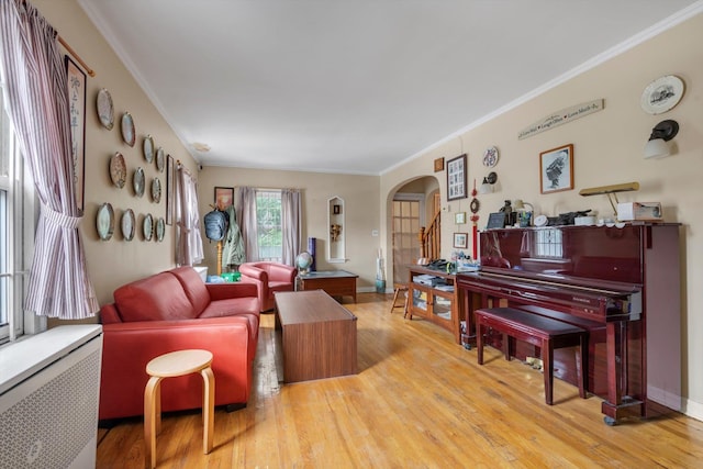 5802 201st St, Bayside, NY 11364 - living area featuring arched walkways, crown molding, and wood finished floors