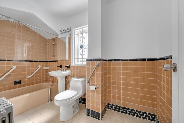 5802 201st St, Bayside, NY 11364 - bathroom featuring tile walls, radiator, tile patterned flooring, bathing tub / shower combination, and a wainscoted wall