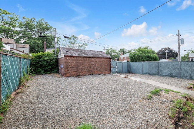 5802 201st St, Bayside, NY 11364 - fenced backyard with a storage shed