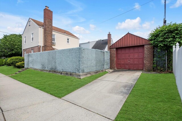 5802 201st St, Bayside, NY 11364 - view of side of home with board and batten siding, brick siding, a detached garage, and an outdoor structure