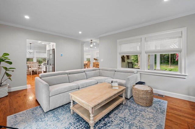 1299 Williams Dr, Shrub Oak, NY 10588 - living area featuring ornamental molding, recessed lighting, and wood finished floors