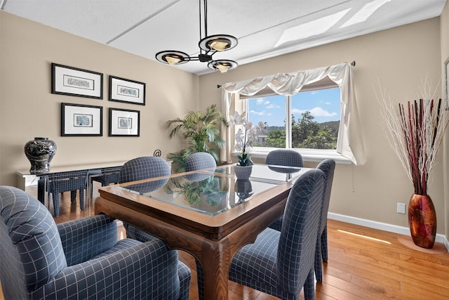 414 Benedict Ave Unit 5B, Tarrytown, NY 10591 - dining room featuring hardwood / wood-style flooring and a chandelier