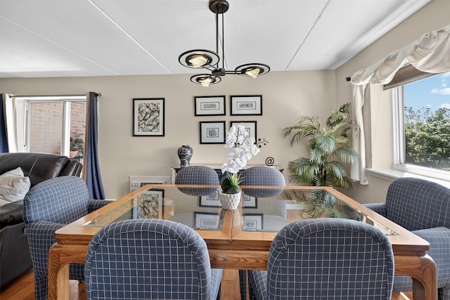 414 Benedict Ave Unit 5B, Tarrytown, NY 10591 - dining space with wood finished floors, healthy amount of natural light, and a chandelier