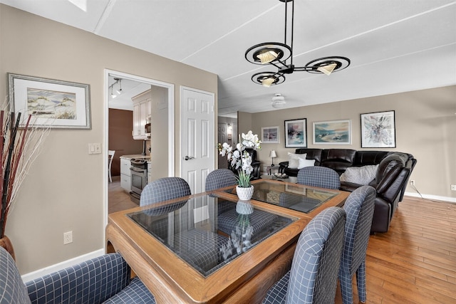 414 Benedict Ave Unit 5B, Tarrytown, NY 10591 - dining room featuring light wood-type flooring and a chandelier