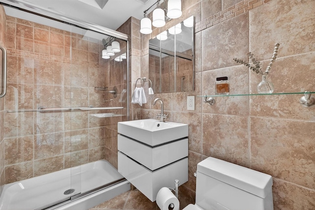 414 Benedict Ave Unit 5B, Tarrytown, NY 10591 - bathroom featuring a shower stall, vanity, and tile walls