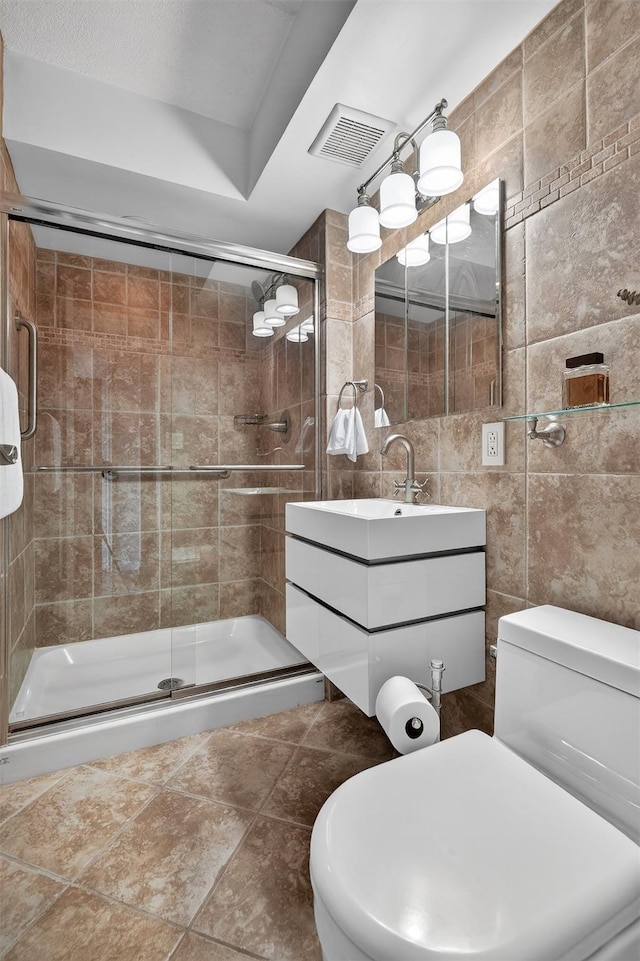 414 Benedict Ave Unit 5B, Tarrytown, NY 10591 - bathroom with tile walls, vanity, and a stall shower
