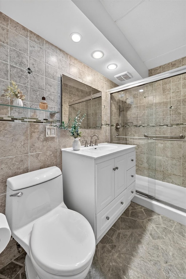 414 Benedict Ave Unit 5B, Tarrytown, NY 10591 - bathroom with tile walls, vanity, a stall shower, and recessed lighting