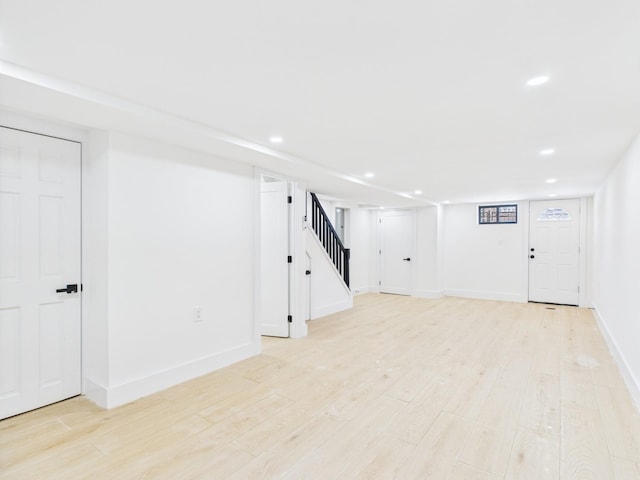 1310 E 223rd St, Bronx, NY 10466 - finished basement with stairway, recessed lighting, and light wood-style floors